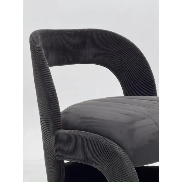 Ring-Frame Pleated Corduroy and Suede Lounge Chair in Black — in a room setting