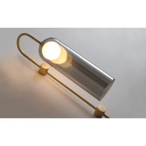 Brass Hook Wall Light with Clear Glass Cylinder Shade in brushed brass — in a room setting
