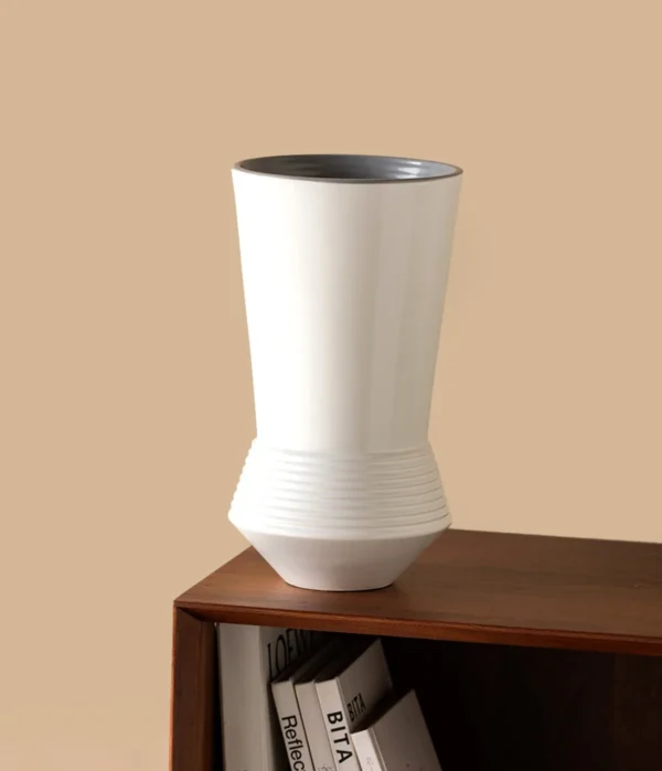 Ring-Stacked Waisted White Ceramic Vase in ivory — in a room setting