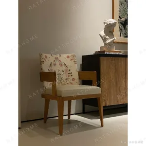 Brushed Oak Armchair with Embroidered Back, 57 cm in natural oak — in a room setting