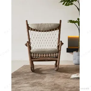 Ash Rope-Woven Rocking Chair with Headrest in walnut — in a room setting