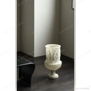 Roman Relief Urn Vase in Cream Resin, Tabletop — in a room setting