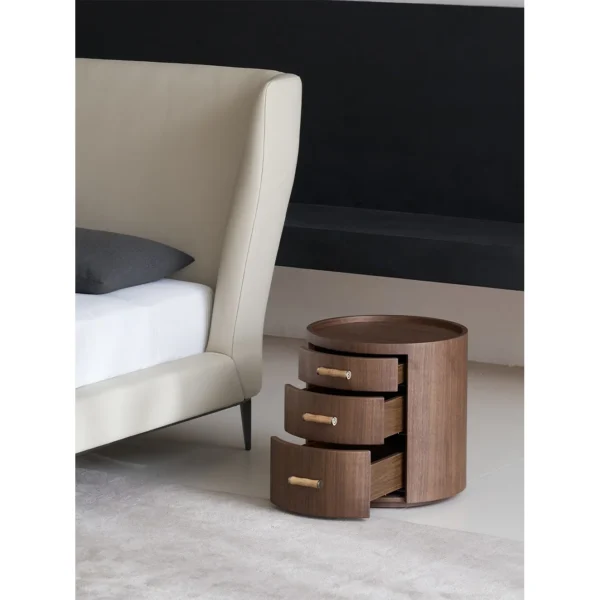 Rond Round Walnut Three-Drawer Nightstand in walnut — in a room setting