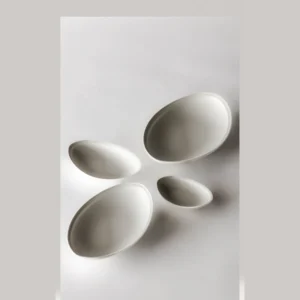 Artist Collaboration Boat-Shaped Ceramic Plates in Off-White — in a room setting