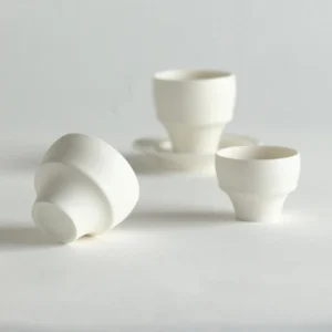Artist Collaboration Folded-Waist Ceramic Hand Cups in oatmeal — front view
