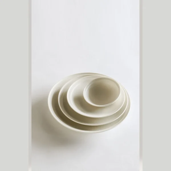 Artist Collaboration Lipped Flat Plates in oatmeal — in a room setting