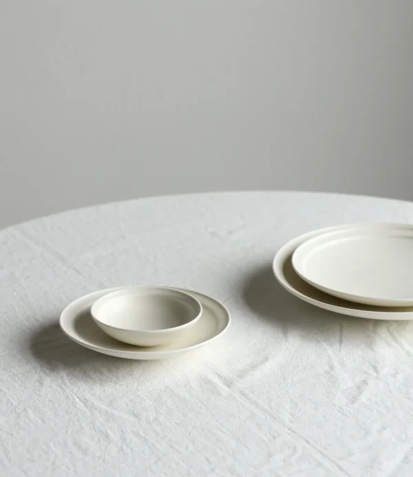 Artist Collaboration Lipped Flat Plates in oatmeal — in a room setting