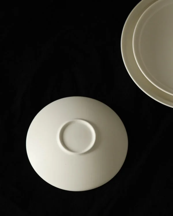 Artist Collaboration Lipped Flat Plates in oatmeal — in a room setting