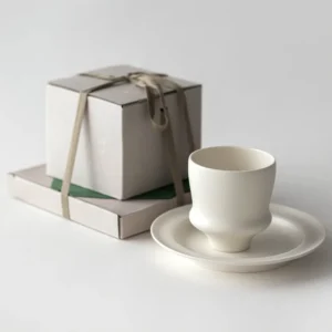 Artist Collaboration White Porcelain Cup and Saucer Gift Set in ivory — front view