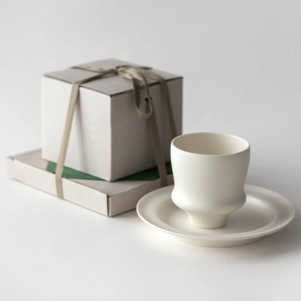 Artist Collaboration White Porcelain Cup and Saucer Gift Set in ivory — front view