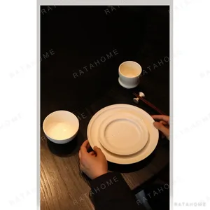 Artist Collaboration White Porcelain Tableware Set for Four in ivory — in a room setting