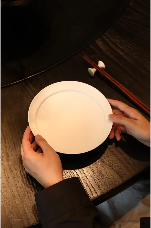 Artist Collaboration White Porcelain Tableware Set for Four in ivory — in a room setting