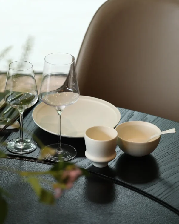 Artist Collaboration White Porcelain Tableware Set for Four in ivory — in a room setting