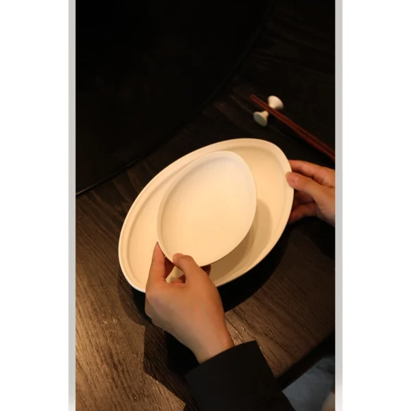 Artist Collaboration White Porcelain Boat Plate Gift Set in ivory — in a room setting