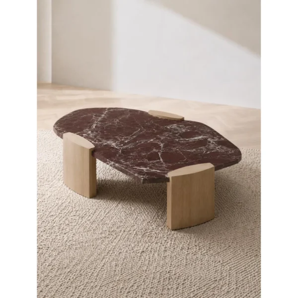 Rosso Levanto Marble Coffee Table on Light Wood Legs in burgundy — in a room setting