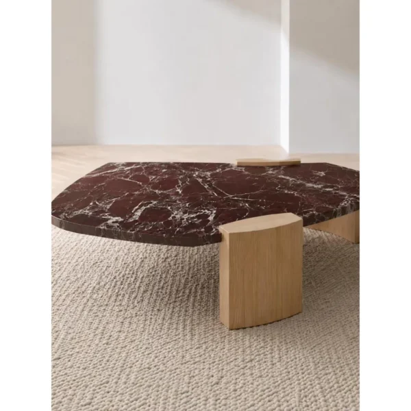 Rosso Levanto Marble Coffee Table on Light Wood Legs in burgundy — in a room setting