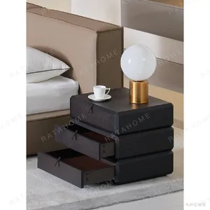 Rotating Three-Drawer Nightstand in Smoked Oak — in a room setting