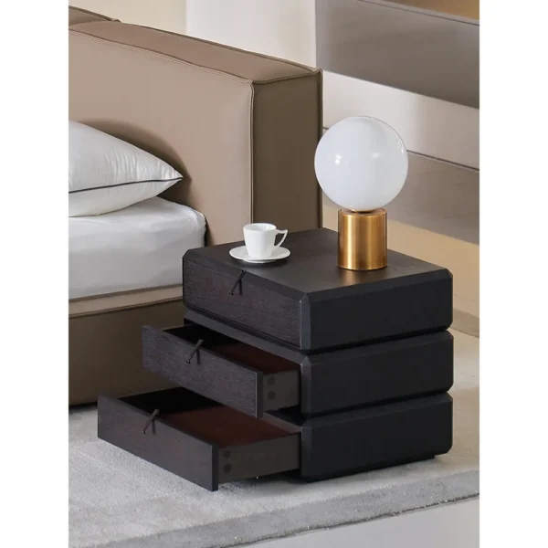 Rotating Three-Drawer Nightstand in Smoked Oak — in a room setting