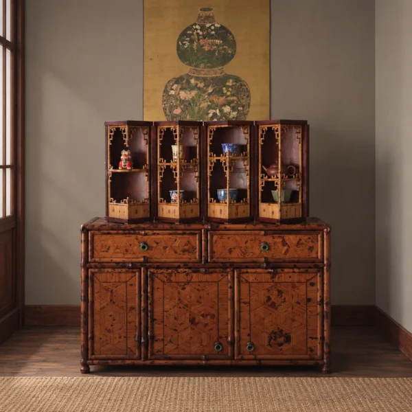 Round Folding Bamboo Treasure Cabinet with Jade Ring Pulls in clay — in a room setting