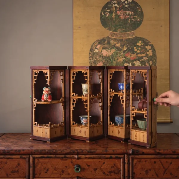 Round Folding Bamboo Treasure Cabinet with Jade Ring Pulls in clay — in a room setting