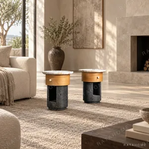 Round Stone Side Table Pair on Wood and Black Stone Bases in oatmeal — in a room setting