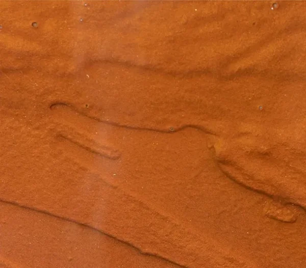 Round Amber Glass Disc Wall Art, 80 cm in rust — detail