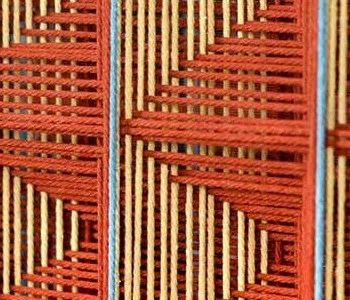 Round Geometric Tile Disc Set of 2 in Rust and Blue — detail