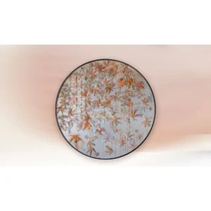 Round Maple Leaf Relief in Orange and Cream, 150 cm — in a room setting