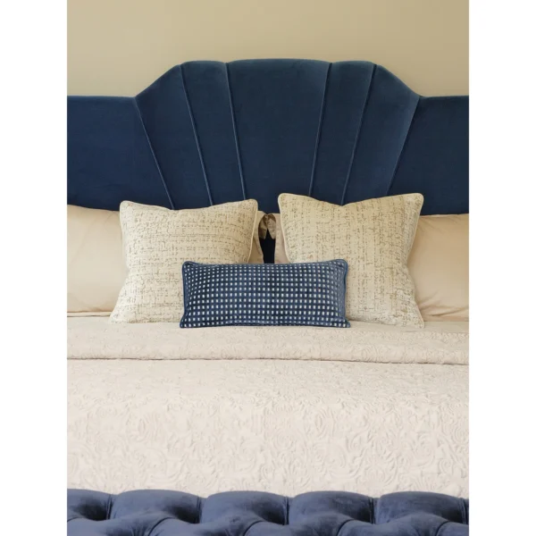 Royal Blue Velvet Bedroom Set with Scalloped Headboard in blue — in a room setting