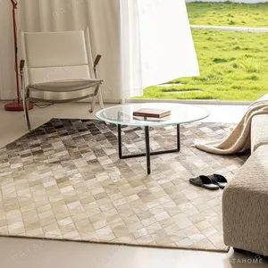 Cowhide Gradient Diamond Patchwork Rug in oatmeal — in a room setting