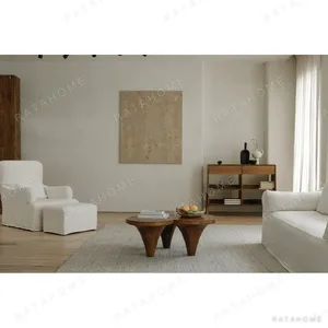 Aged Wood Round Coffee Table on Twin Cone Bases in natural oak — in a room setting
