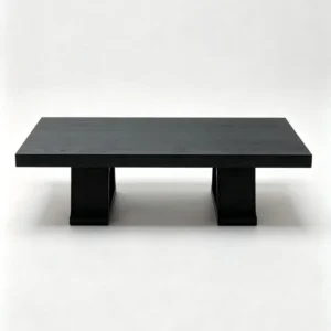Saddle Black Oak Coffee Table on Slab Legs, 135 x 90 cm in black — front view