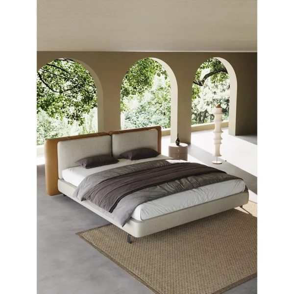 Saddle Leather and Linen Wide Headboard Bed in clay — in a room setting