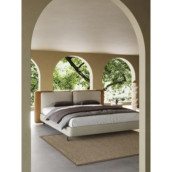 Saddle Leather and Linen Wide Headboard Bed in clay — in a room setting