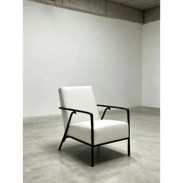 Forged Bronze Armchair in Cream Leather, 65 cm — in a room setting