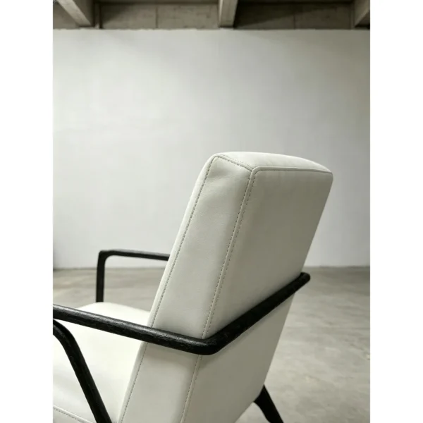Forged Bronze Armchair in Cream Leather, 65 cm — in a room setting