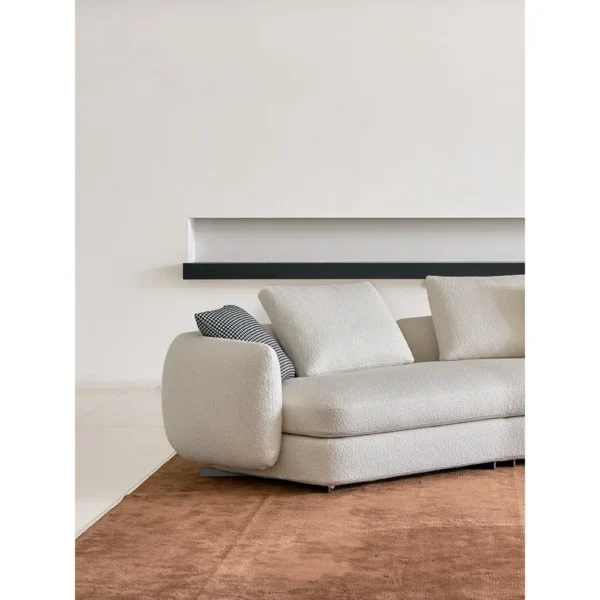 Ring-Arm Curved Sofa in Cream Fabric with Ring Detail — in a room setting