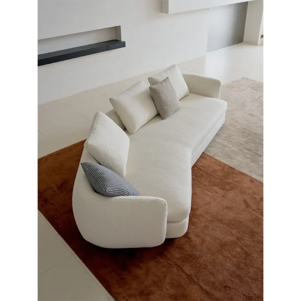 Ring-Arm Curved Sofa in Cream Fabric with Ring Detail — in a room setting