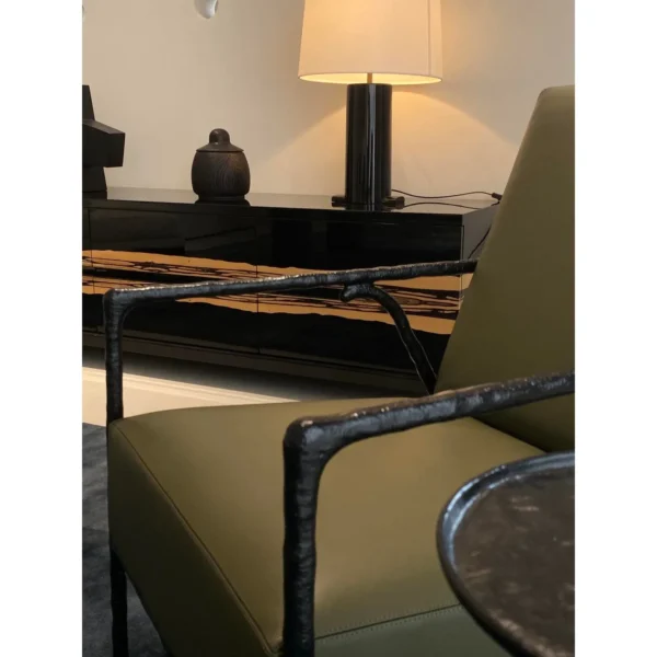Forged Bronze Armchair in Olive Leather, 65 cm — in a room setting