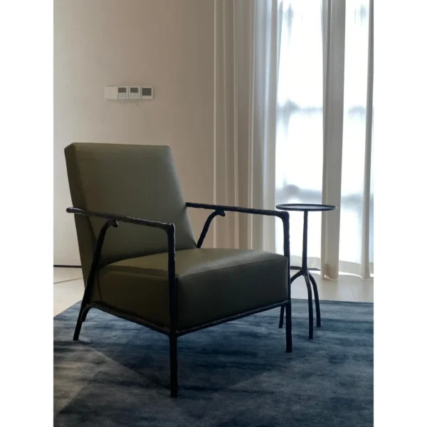 Forged Bronze Armchair in Olive Leather, 65 cm — in a room setting