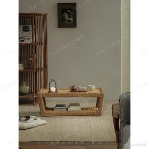Hand-Woven Rattan Sandwich Tatami Coffee Table in sand — in a room setting