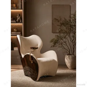 Sculptural Cigar Chair in oatmeal — in a room setting
