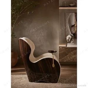 Sculptural Cigar Chair in oatmeal — in a room setting