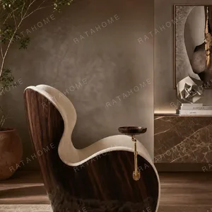 Solitude Sculptural Cigar Chair with Swivel Brass Tray in oatmeal — in a room setting