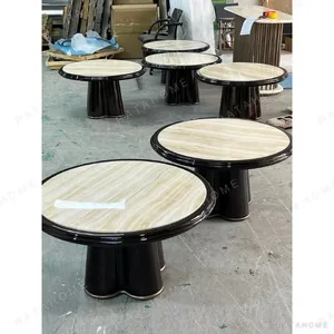 Round Honey Onyx Coffee Table on Black Lacquer Petal Base in brushed brass — in a room setting