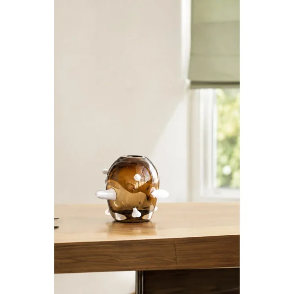 Sculptural Amber Glass Vase with Pale Studs in clay — in a room setting