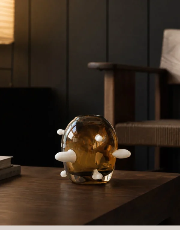 Sculptural Amber Glass Vase with Pale Studs in clay — in a room setting