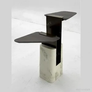 Sculptural Two-Tier Wood Side Table on Marble Block Base in black — in a room setting
