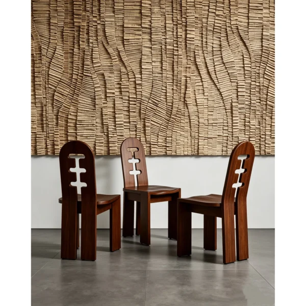 Round Oak Dining Table on Perforated Sculptural Base in natural oak — in a room setting