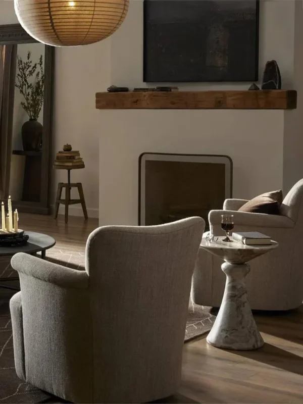Sculptural Grey Marble Side Table with Fluted Cone Base in ivory — in a room setting